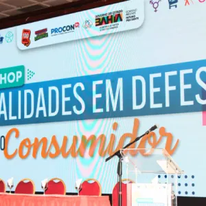 painel escrito "workshop atualidades em defesa do consumidor"