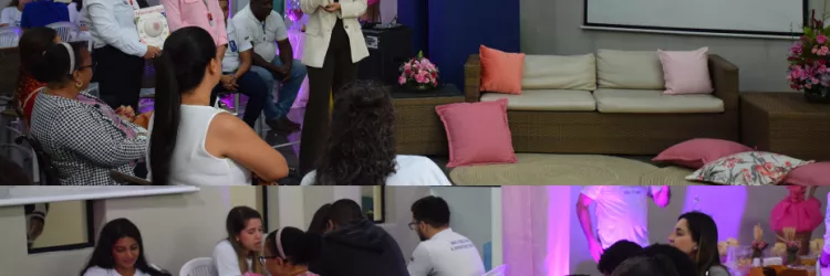 A imagem mostra dois momentos de um evento sobre o Outubro Rosa. Na parte superior, uma mulher fala ao microfone diante de um público sentado; atrás dela há uma tela com a frase “Prevenir é viver – A luta contra o câncer de mama” e o fundo rosa com mulheres usando lenços. Ao lado, pessoas observam atentamente. O ambiente tem decoração em tons de rosa e flores. Na parte inferior, grupos de pessoas sentadas em mesas conversam e preenchem papéis, em um espaço também decorado com luz rosa e flores.