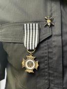 Medalha de mérito recebida pelo servidor.